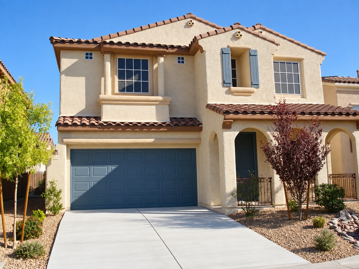 Completed stucco residence with covered entry