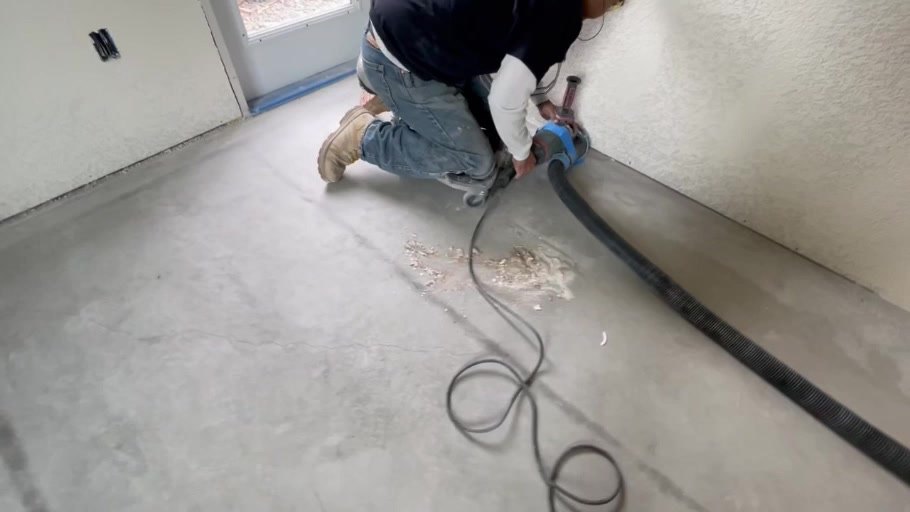 Crew grinding and polishing the new concrete floor