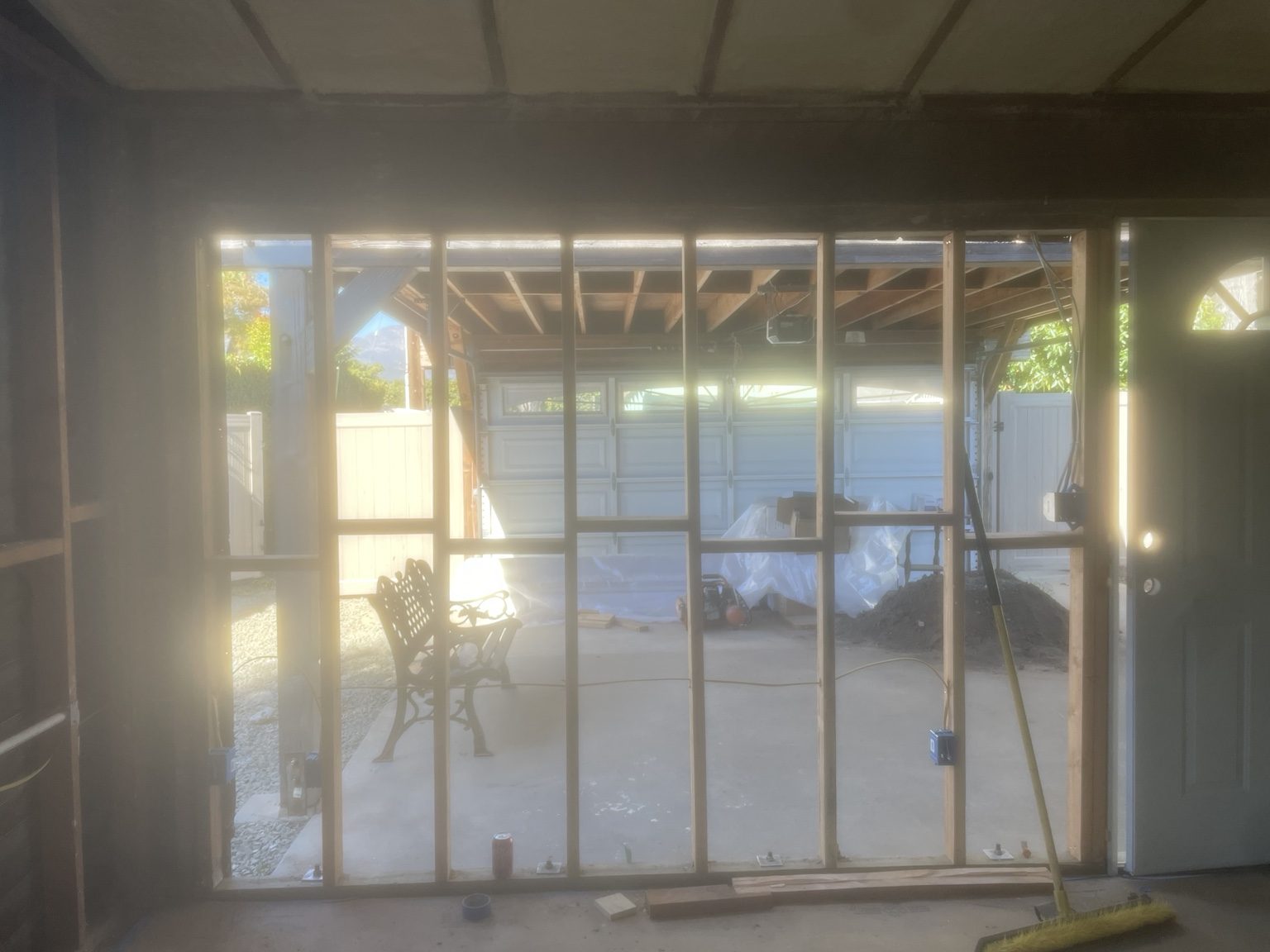 New stud wall framed under the existing garage door beam