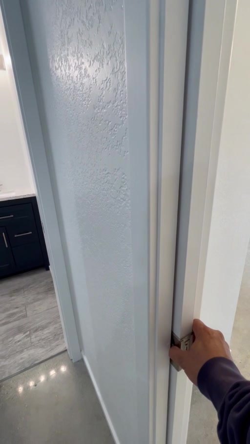 Pocket door sliding into the wall