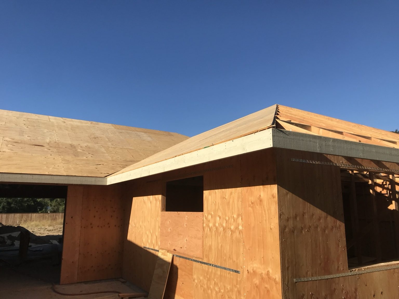 Plywood wall and roof sheathing on the new structure