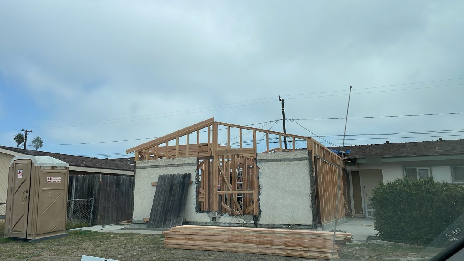 New roof framing going up over the existing garage walls
