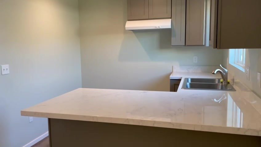 Quartz peninsula and sink in the ADU kitchen