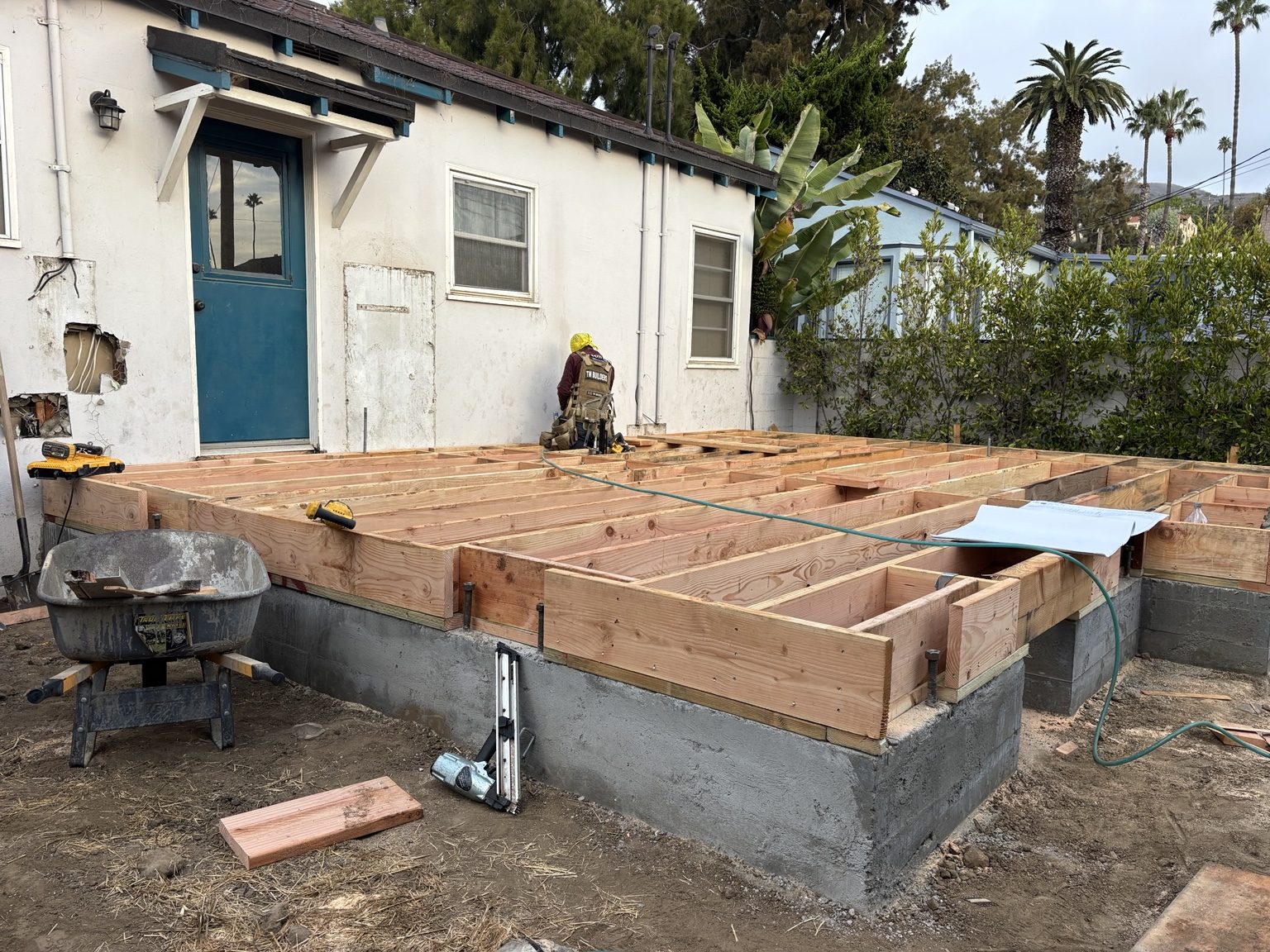 Raised floor framing on the new stem wall, level with the existing house