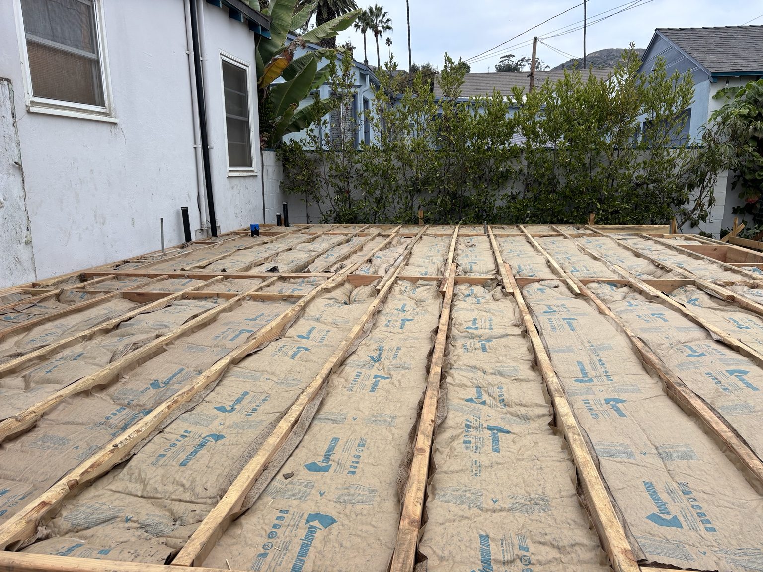 Insulation installed between the new floor joists