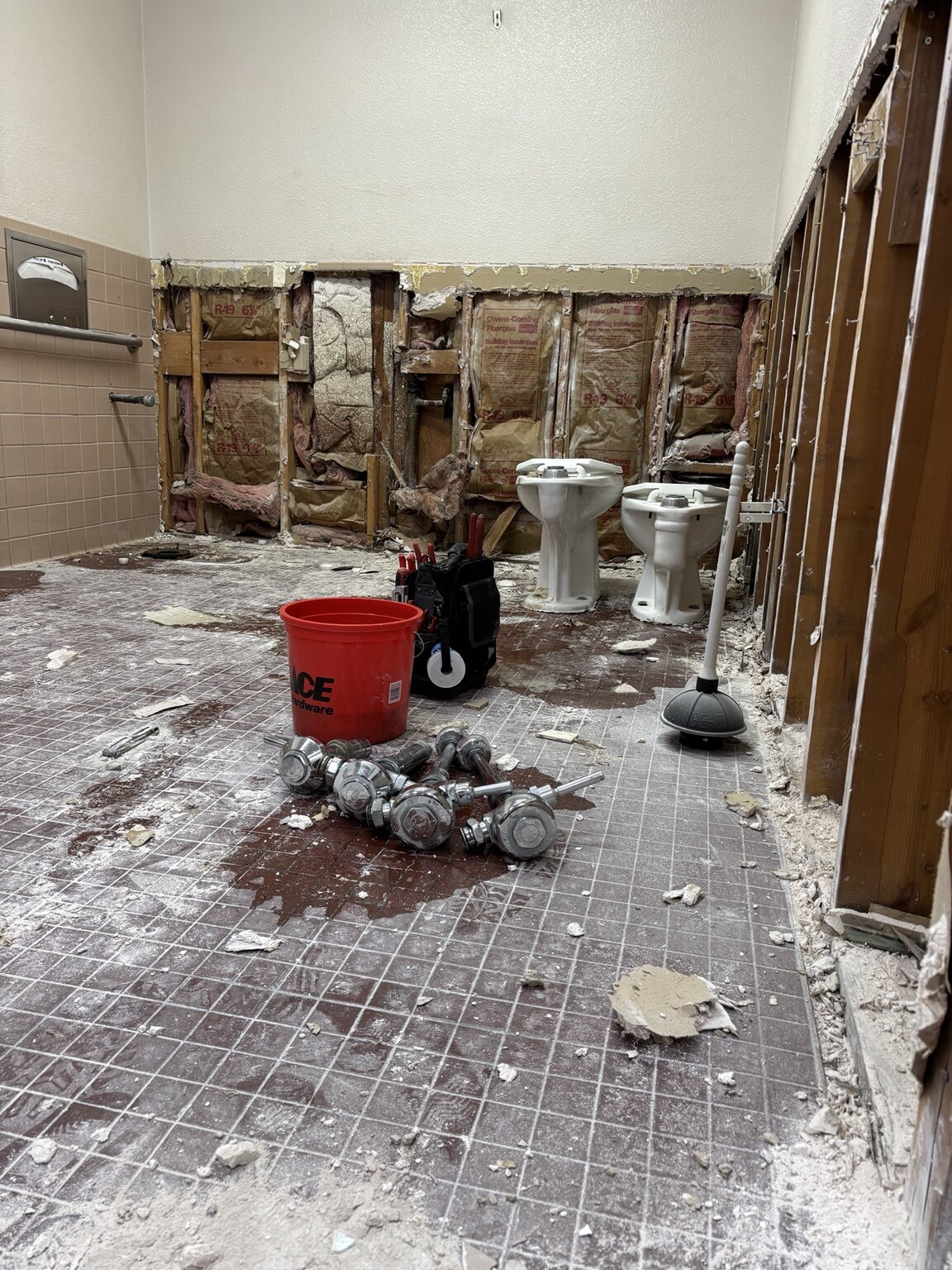 Commercial restroom during demolition