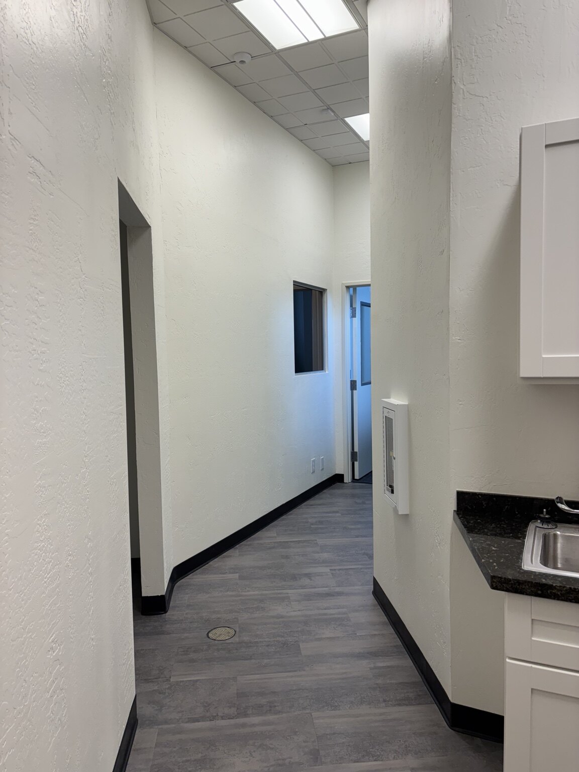 Completed commercial corridor with new doors and finishes